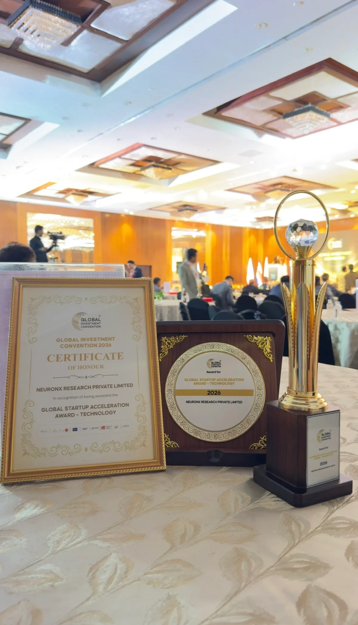 The Global Startup Acceleration Award certificate, plaque, and trophy presented to NeuronX Research Private Limited.
